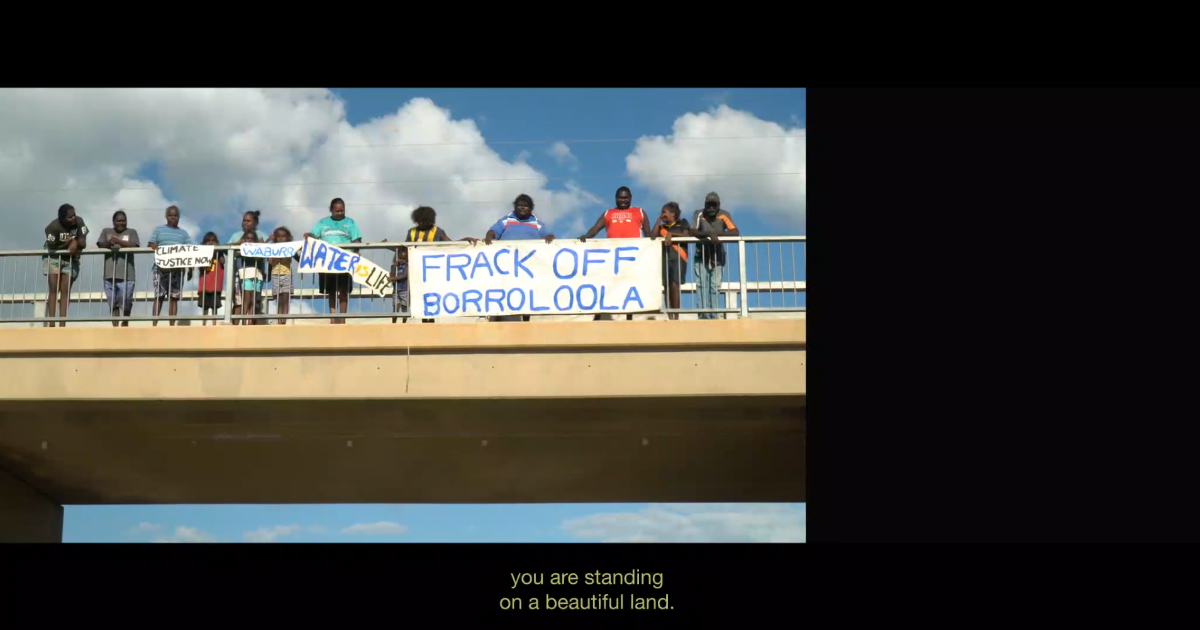 Video Still, Borroloola National Day of Action for Climate, in 'INFRACTIONS', 2019, 1:03:00, HD video, split screen with text, Dolby 5.1. Dir. Rachel O’Reilly. www.infractionsdocumentary.net
