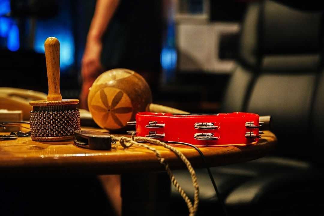 Several percussion instruments on a side table