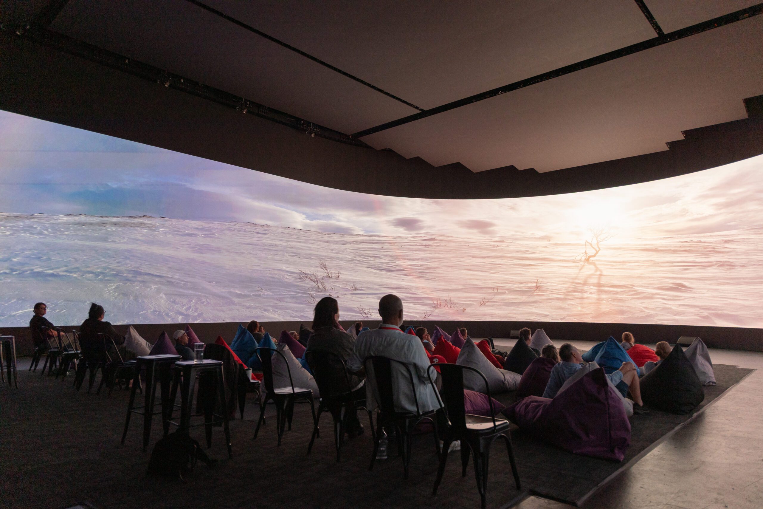 A purple film poster showing art work promoting the 2021 Birrarangga Film Festival